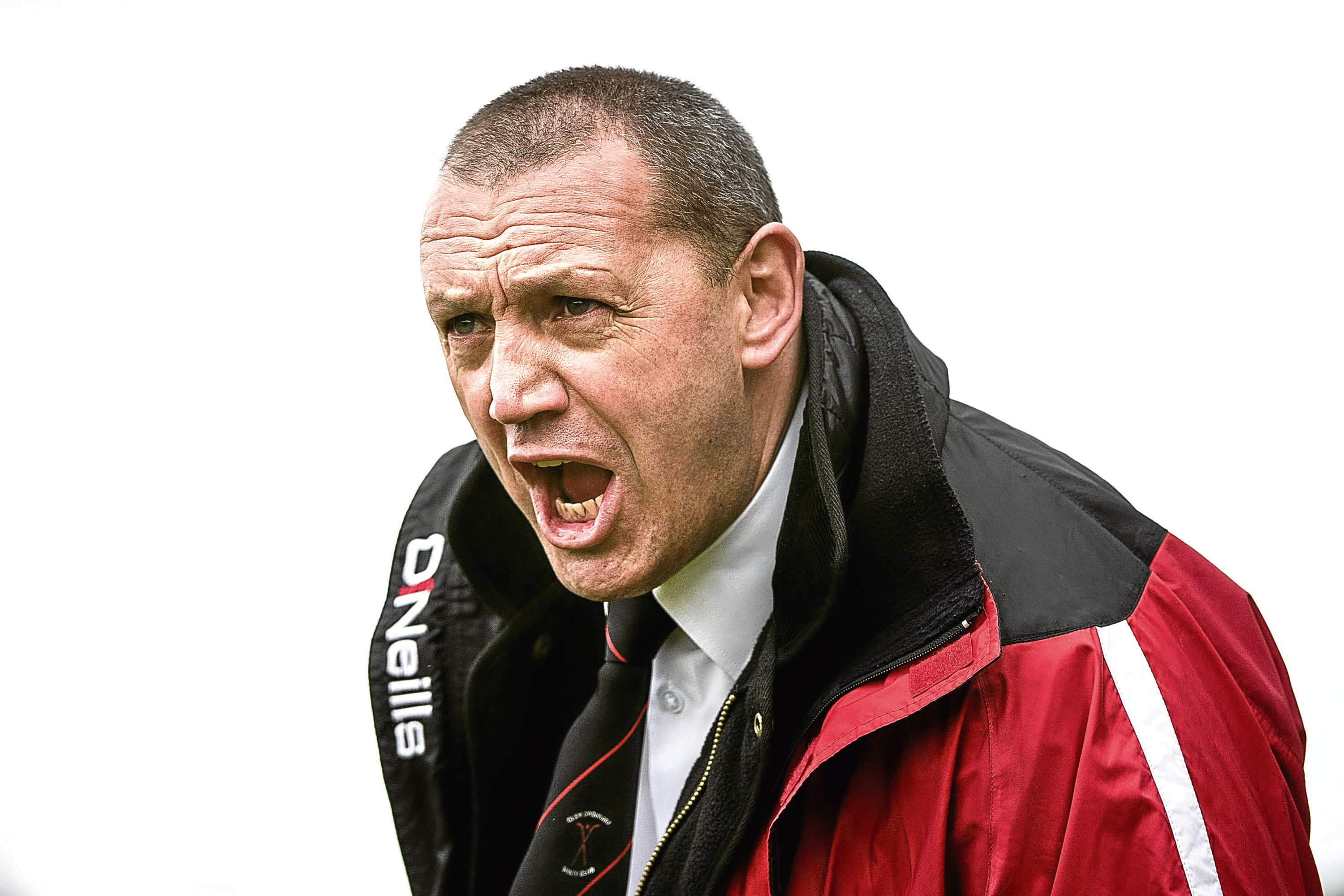 Glenurquhart co-manager Drew MacNeil shouts instructions from the touchline.  Lovat v Glenurquhart (MacAulay Cup 1st Round) played at Balgate, Kiltarlity.  Glenurquhart are the holders of this cup.