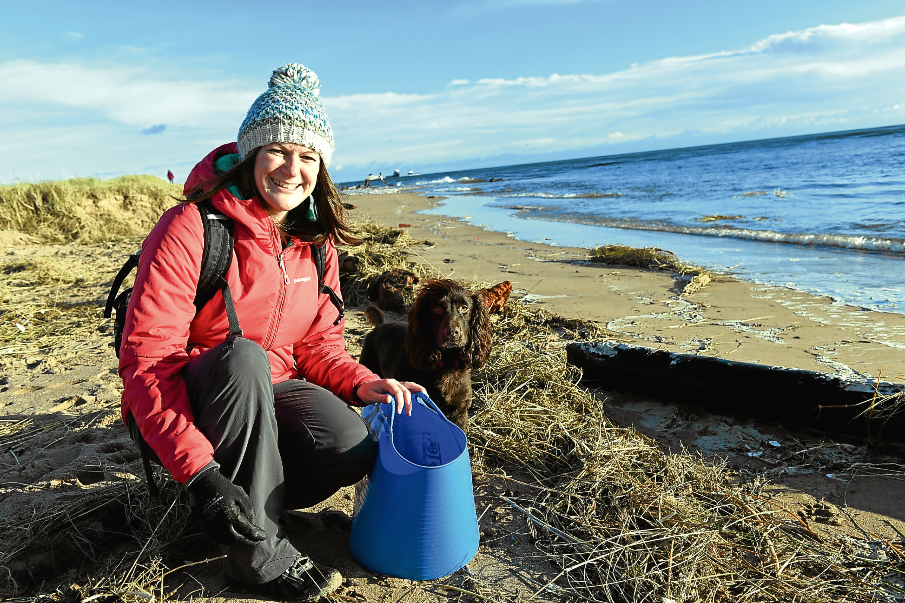 Marine biologist Lauren Smith, who also represents Aberdeen for Surfers Against Sewage, organises beach clean ups and is often helped by her spaniel Tattie.     
Picture by Kami Thomson