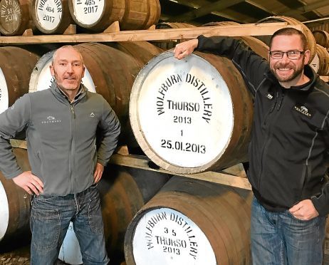 Production manager Shane Fraser, left, and assistant manager Iain Kerr with Cask No 1 at Wolfburn distillery