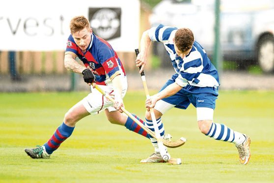 Fraser Munro (Kingussie) and Drew Macdonald (Newtonmore).  in action