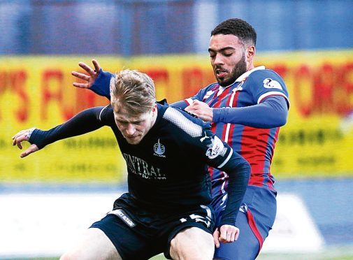 Inverness's Jake Mulranney (R) in action against  Tommy Robson