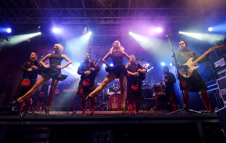 Gig at the Brig Hogmanay Celebrations in Ellon. Red Hot Chilli Pipers on stage. Picture by KATH FLANNERY