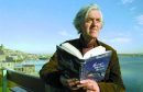 George Mackay Brown with his book "Beside the Ocean of Time".