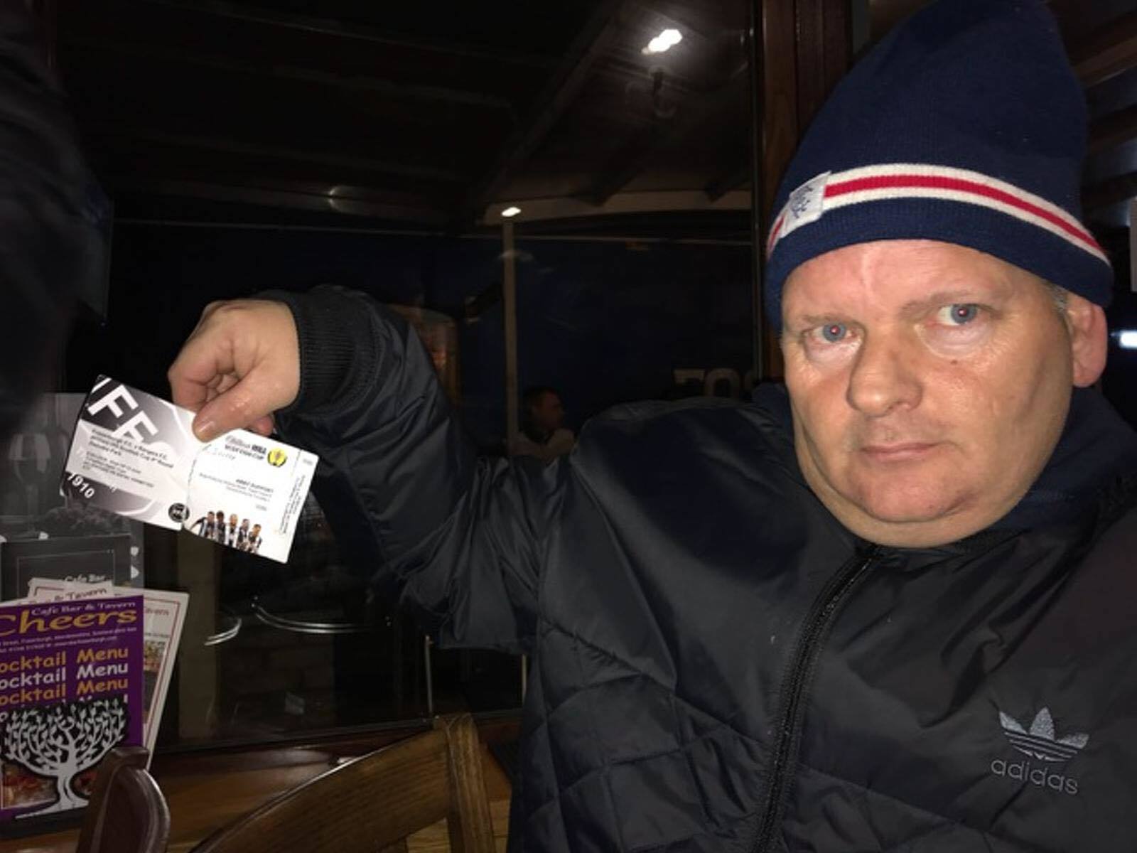 Gers fans Brian Robertson showing an allegedly fake ticket.