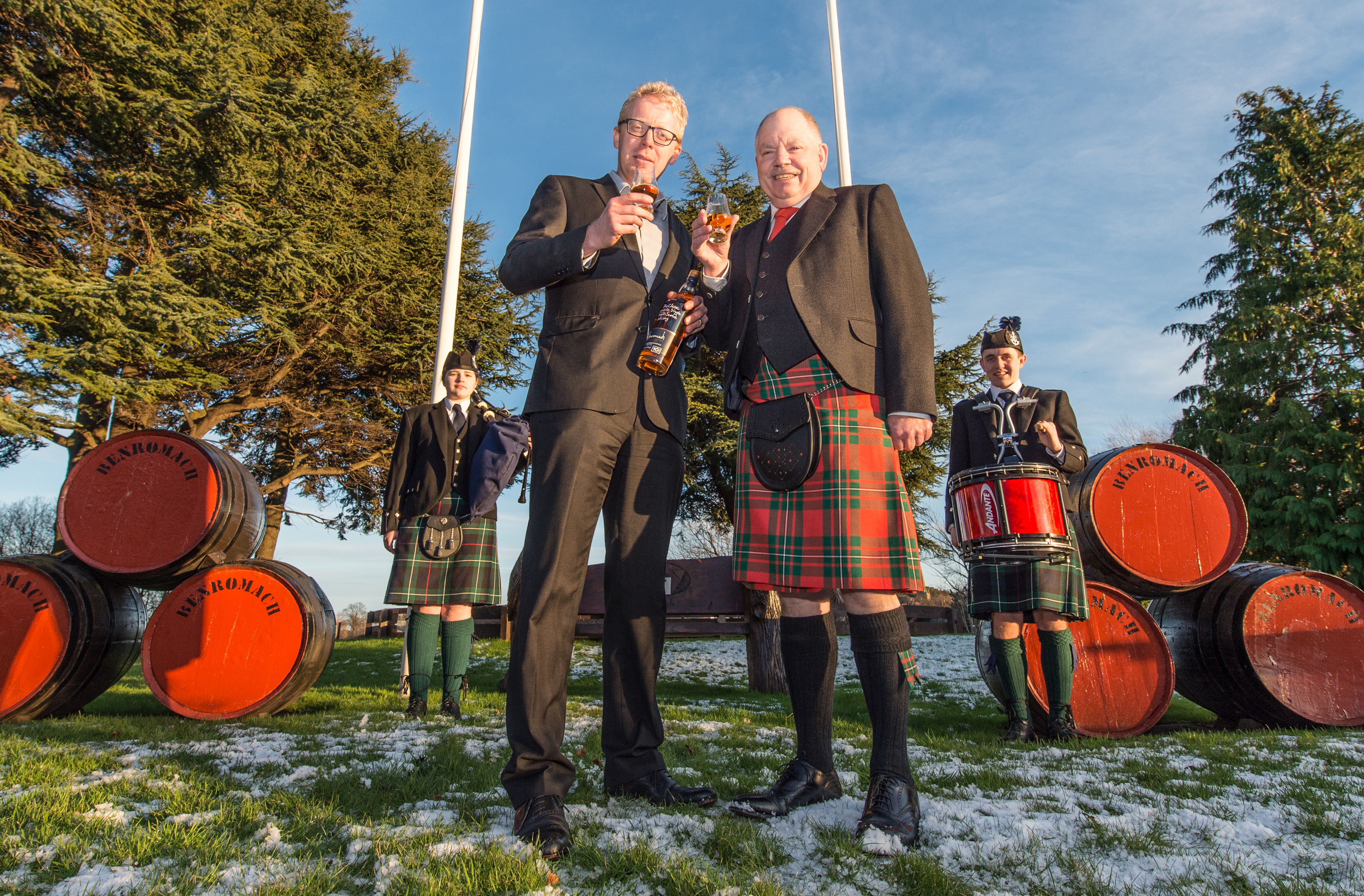 The new Chieftan of piping at Forres, Mr Alan James pictured at Ben Romach Distillery (Right) and accompanied by Ian Chapman (Left) MD of Ben Romach Distillery.