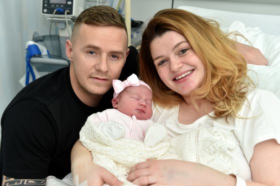 Ashley Neilson and partner Dean Hepburn from Peterhead, with baby daughter Harlo.

Picture by Kenny Elrick