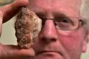 Glyn Lewis with what he hopes is a meteor fragment. 

Picture by Kenny Elrick
