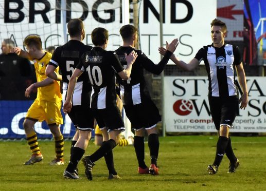 Paul Campbell celebrating with team mates after scoring to make it 5-1. Pictures by Kenny Elrick