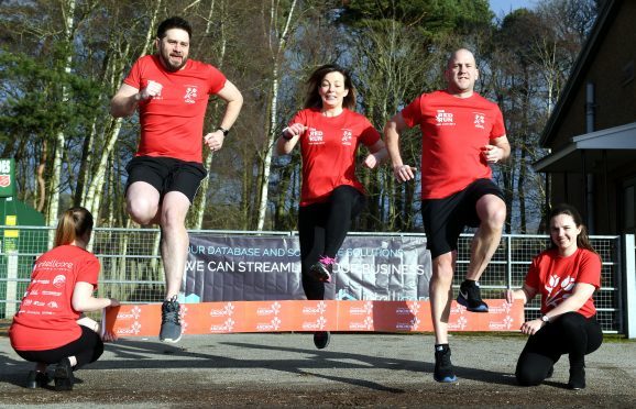 Pictured - L-R Barry Booth (Intellicore), Wendy Bridger and Michael Howden (Red Run organisers) leap over the tape with Ursula Fairlie of Friends of ANCHOR (right).     
Picture by Kami Thomson