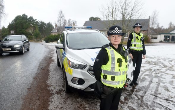 Constables Sharon Strang (left) and Clare Maclennan of Police Scotland outside Abernethy Primary School where they are monitoring traffic and drivers in a bid to improve safety. Picture by Sandy McCook.