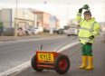 Eight year old Kyle Mackay of Kiltarlity with his new grit spreader with which he was presented in Inverness yesterday to help keep the villages pavements free of ice.