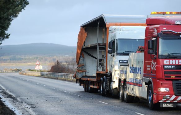 The articulated lorry is removed from the Dornoch Bridge yesterday afternoon after striking the barrier in high winds.Pic by Sandy McCook