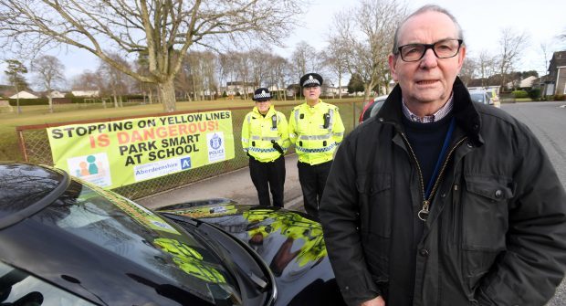 A community safety group is appealing to parents to avoid parking near school gates and was launched at Elrick Primary School.
Pictured is Councillor Ron Mckaill Chairman of the community safety group and looking on are from left, PC's Nicole Garden and Steve Middleton.
Pic by Chris Sumner
Date 31/1/18