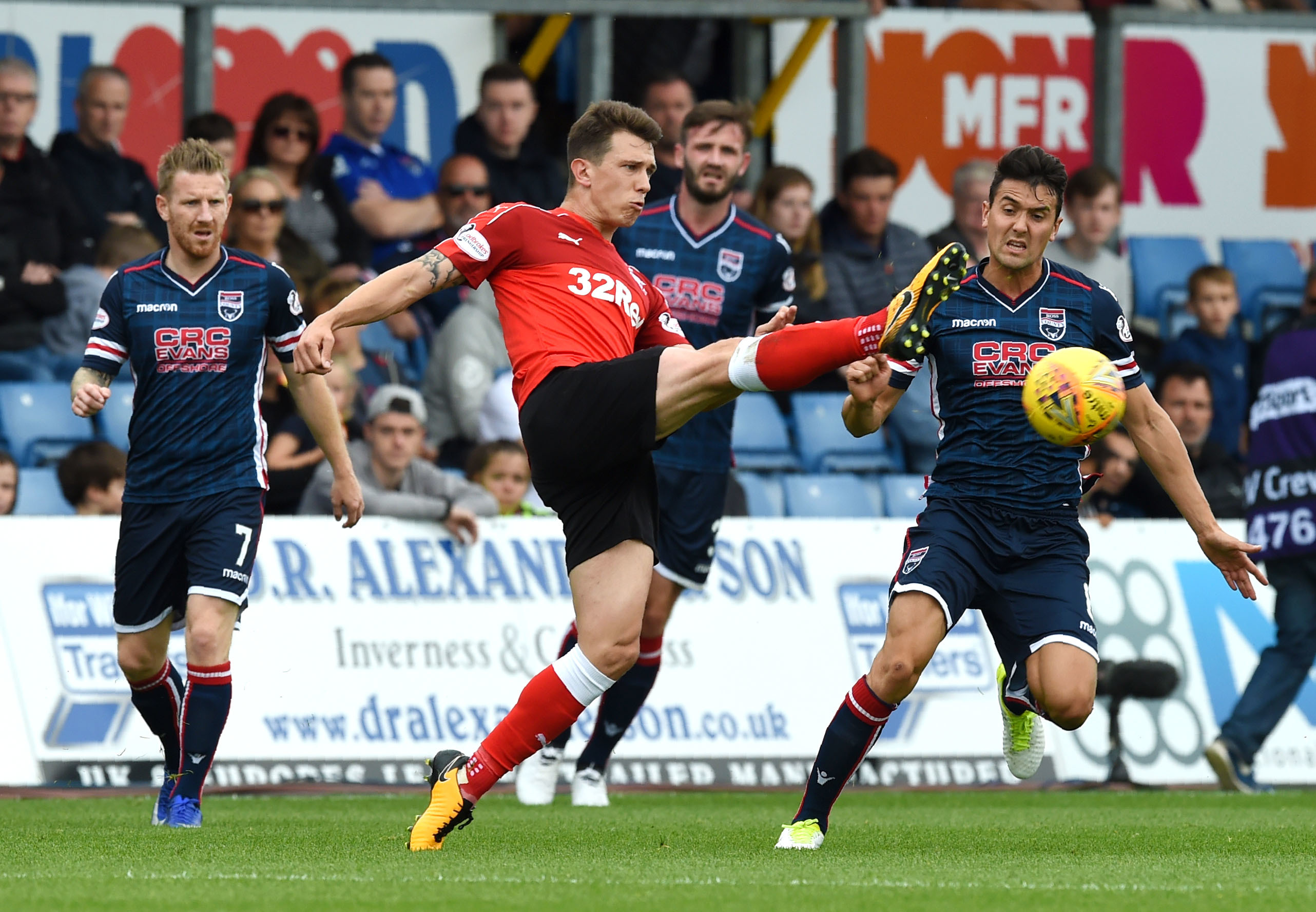 Rangers' Ryan Jack battles with Ross County's Tim Chow during the teams' meeting in Dingwall in August