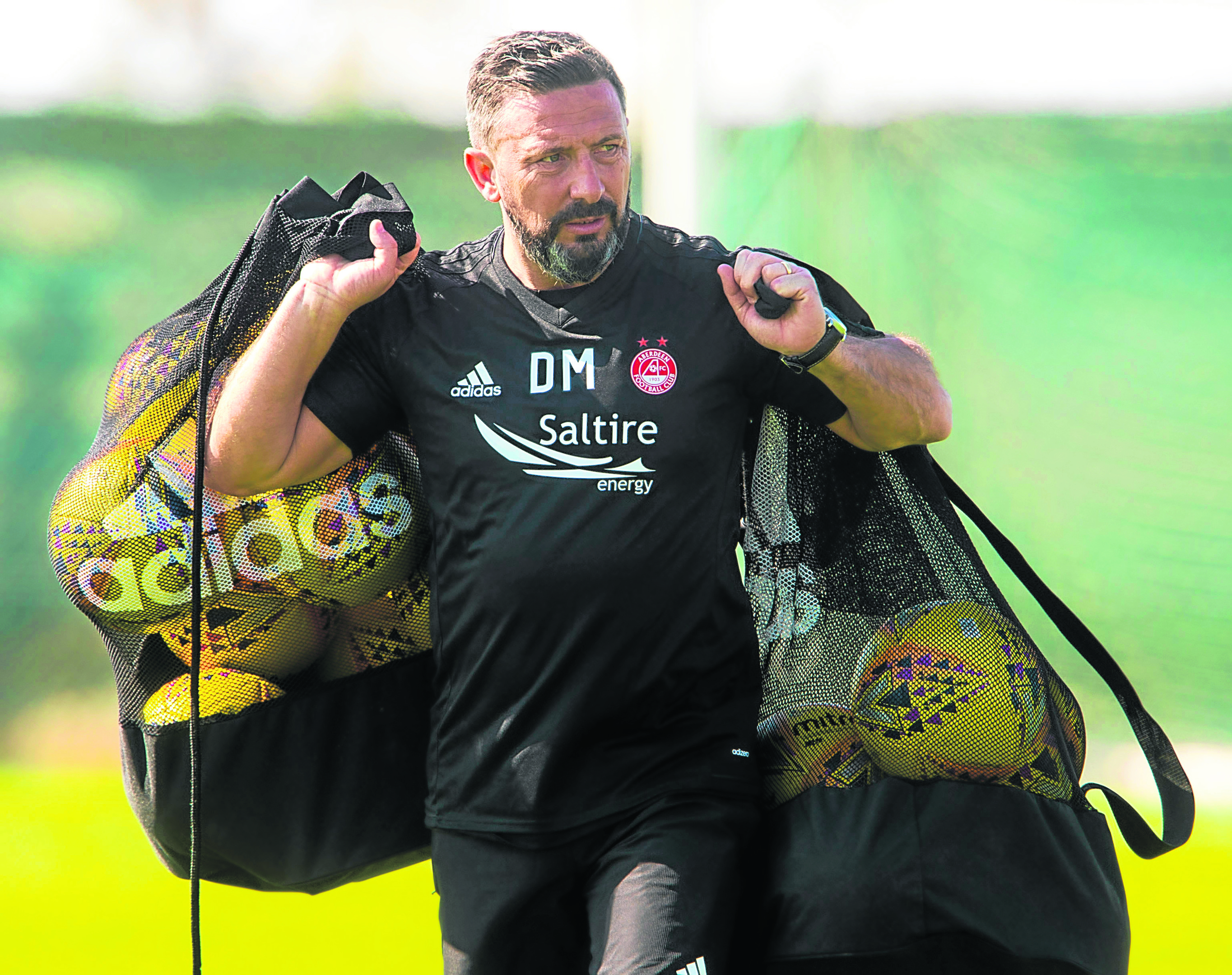Aberdeen manager Derek McInnes at training in Dubai.
