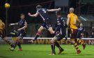 Ross County debutant Harry Souttar heads the ball into the back of his own net.