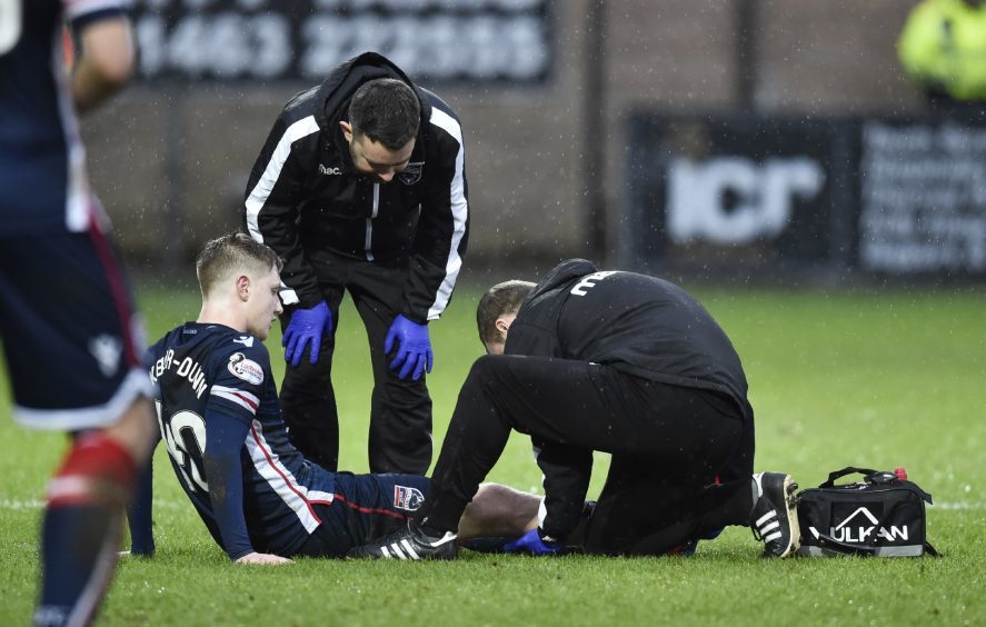 Ross County's Davis Keillor-Dunn is treated on the pitch.