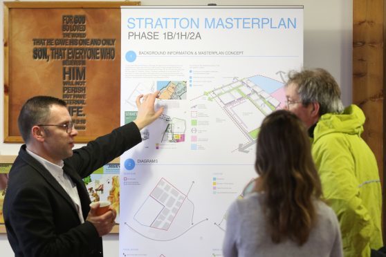 Plans for a new housing development near Smithton in Inverness on display at Smithton Free Church. This pic: Rory Kellett and Skye Sturm from Threesixty Architecture discussed the plans with Martin MacLeod from nearby Balloch
