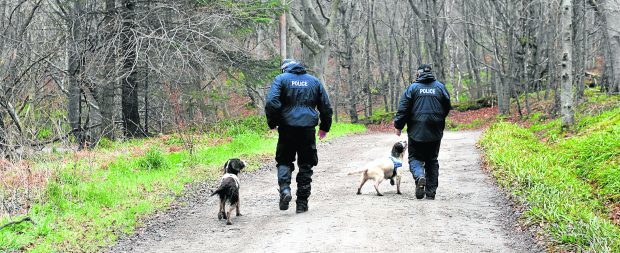 Police during the search for missing man Ian Bramald in 2014