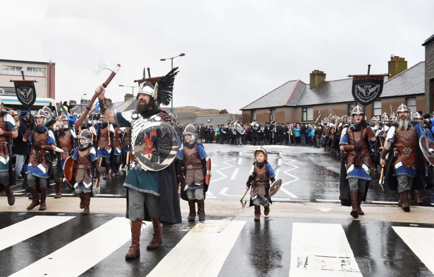 Shetland - Up Helly Aa - 2018 - Tuesday morning - The parade. Guizer Jarl Stewart Jamieson with one of the younger squad Odin Geddes, 4.
Picture by COLIN RENNIE  January 30, 2018.