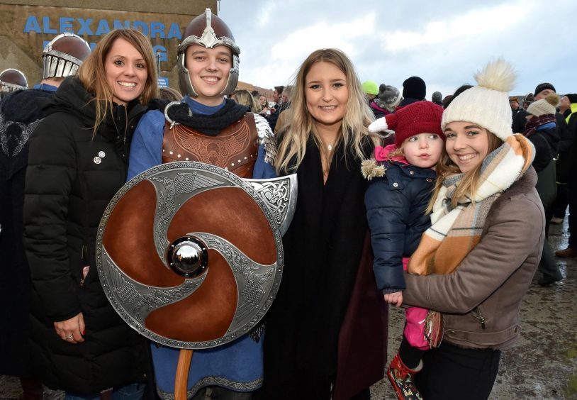 Shetland - Up Helly Aa - 2018 - Tuesday morning - The parade. Squad member Logan Grant with (from left) Julie Manson, Dione Paul, Grace Morrison, 3 and kristi Grant.
Picture by COLIN RENNIE  January 30, 2018.