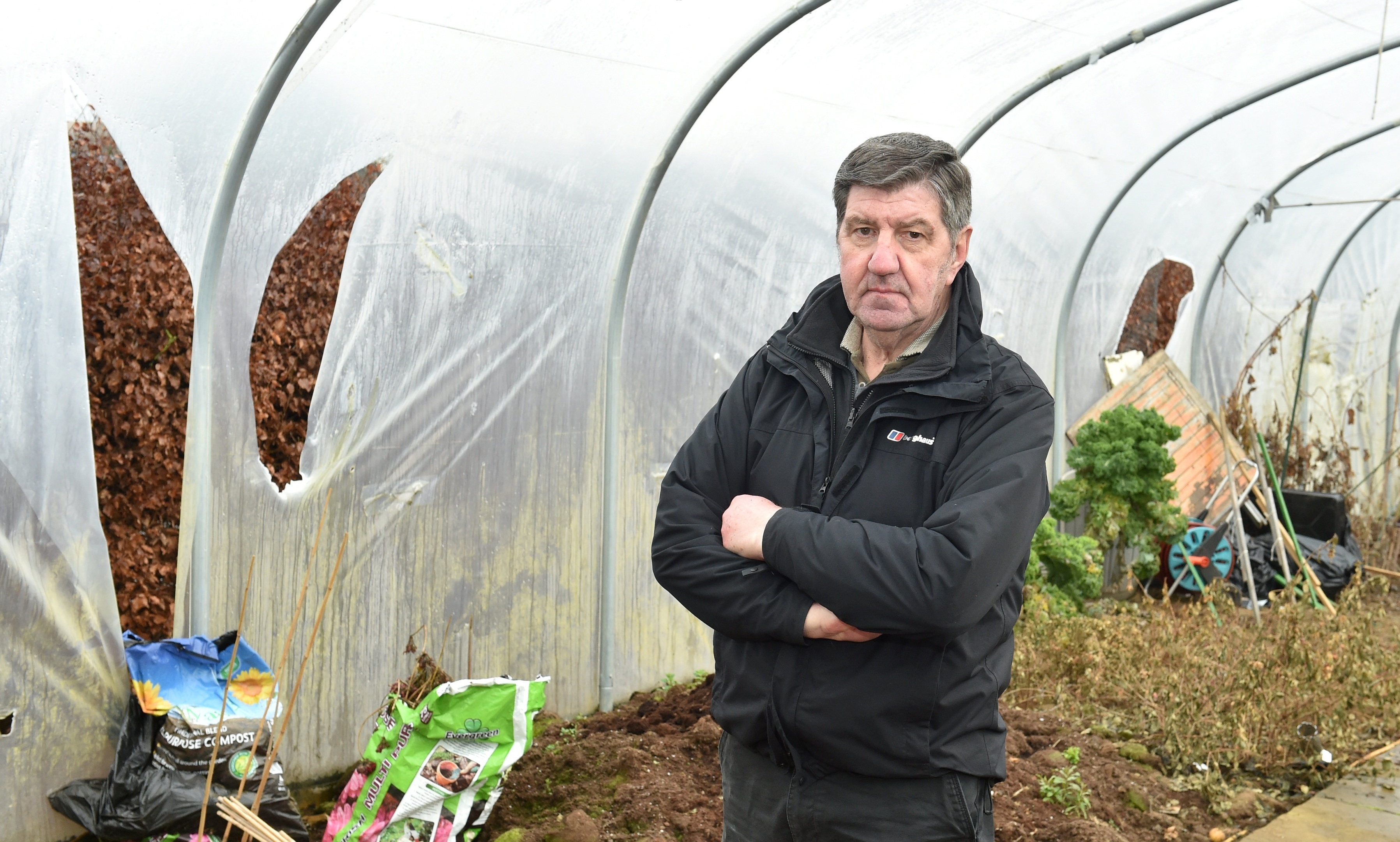 Inverurie Men's Shed was once again vandalised. Alistair Smith surveys the polytunnel which will cost around £1000 to replace.
(Picture by Colin Rennie)