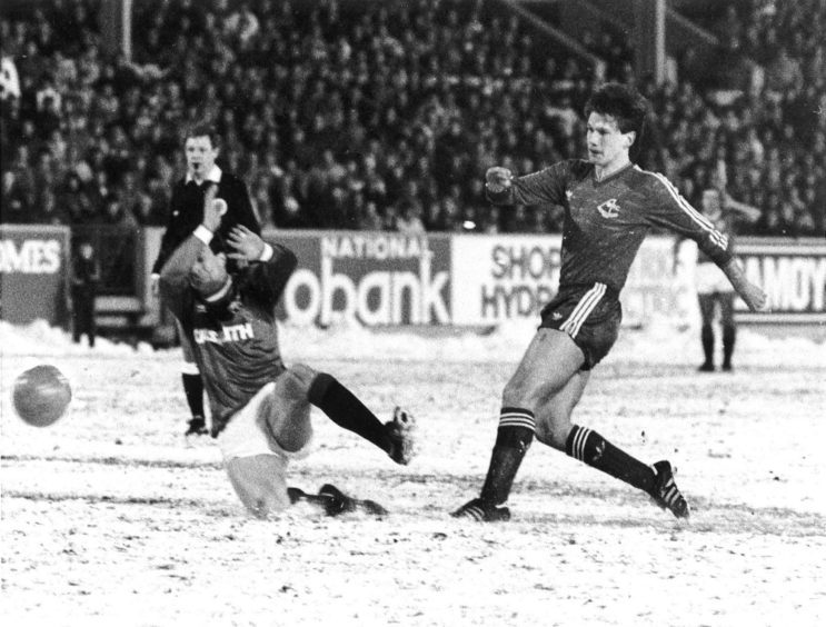 Cammy Fraser is powerless to stop Aberdeen's winning goal - a great left foot drive from Ian Angus in the 67th minute at Pittodrie.
Aberdeen v Rangers 19th Feburary 1986