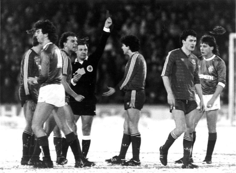 Dons Neale Cooper and Tommy McQueen appeal to the referee Jim Duncan after Jim Brett (right) is sent off at Pittodrie

Aberdeen v Rangers 19th Feb 1986
