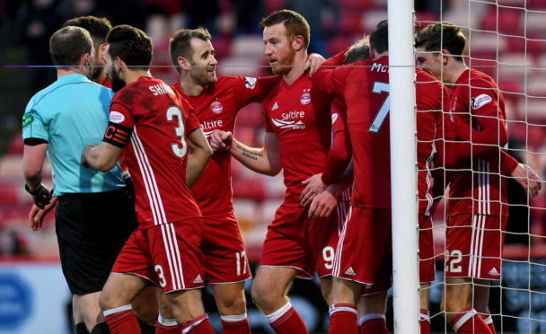 Aberdeen's Adam Rooney celebrates his goal with team mates yesterday.