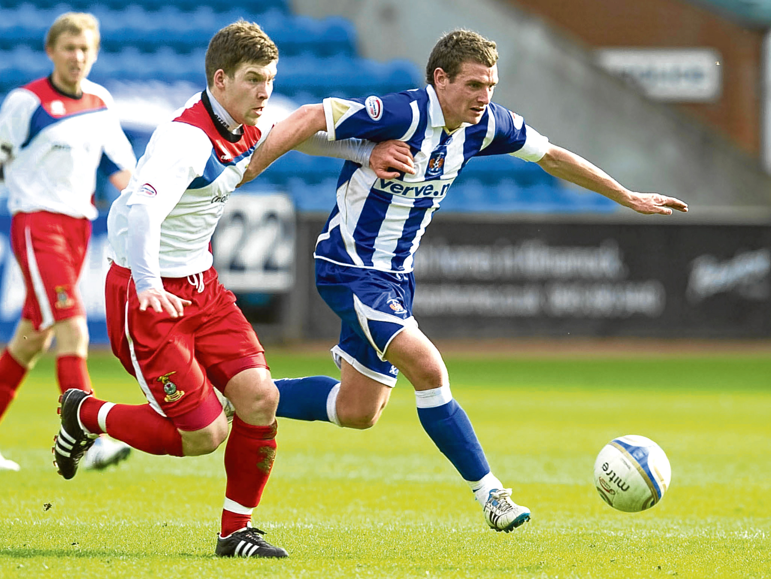 Kilmarnock's Craig Bryson (right) is challenged by Gavin Morrison in 2011