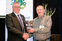 NFU Scotland president Andrew McCornick presents the union's David Miskelly award to Sutherland crofter Sandy Murray