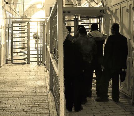 Locals waiting patiently inside a checkpoint