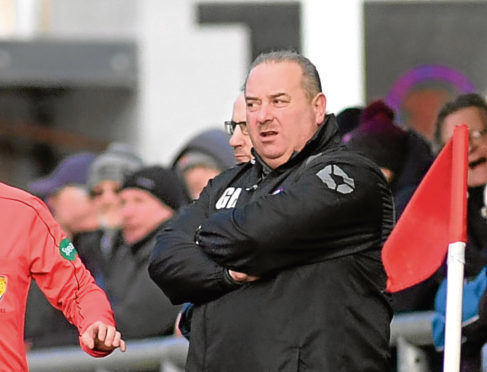 Turriff's manager Graeme Roy on the touchline.