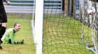 Fort William keeper Martin MacKinnon watches the 9th goal go into his net.
Pictures by Colin Rennie.