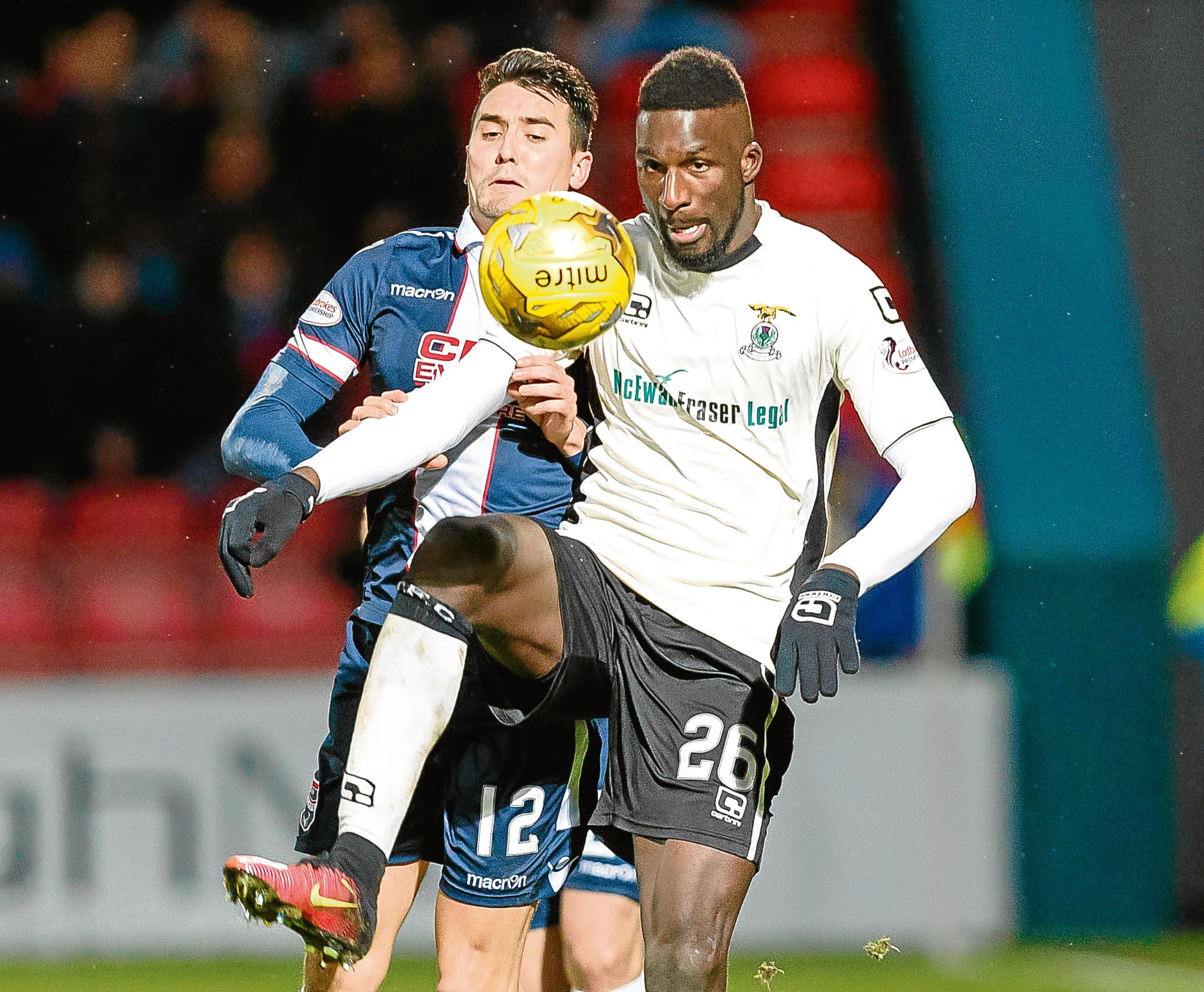 Tim Chow in action for Ross County against Caley Thistle's Lonsana Doumbouya in December 2016.