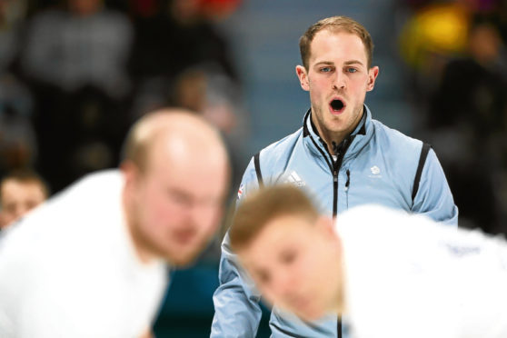 GANGNEUNG, SOUTH KOREA - FEBRUARY 14:  Kyle Smith of Great Britain compete in the Curling Men's Round Robin Session 1 held at Gangneung Curling Centre on February 14, 2018 in Gangneung, South Korea.  (Photo by Dean Mouhtaropoulos/Getty Images)