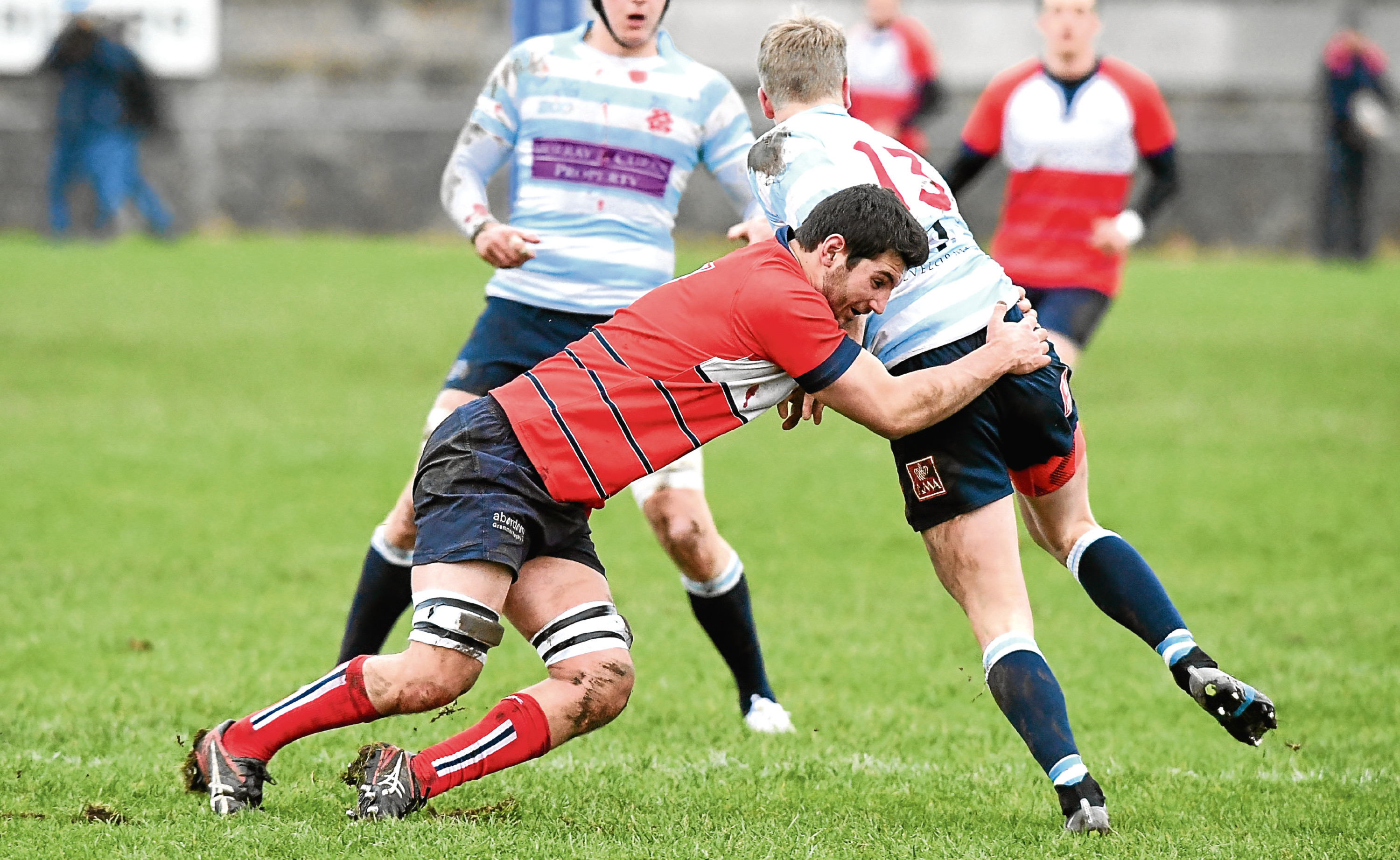 RUGBY ; 
BT National League Division 1 ; 
Aberdeen Grammar (red) v Edinburgh Accies (blue/white) -     
Pictured - Grammar's Will Alton tackling Robbie Chalmers     
Picture by Kami Thomson    13/1/18