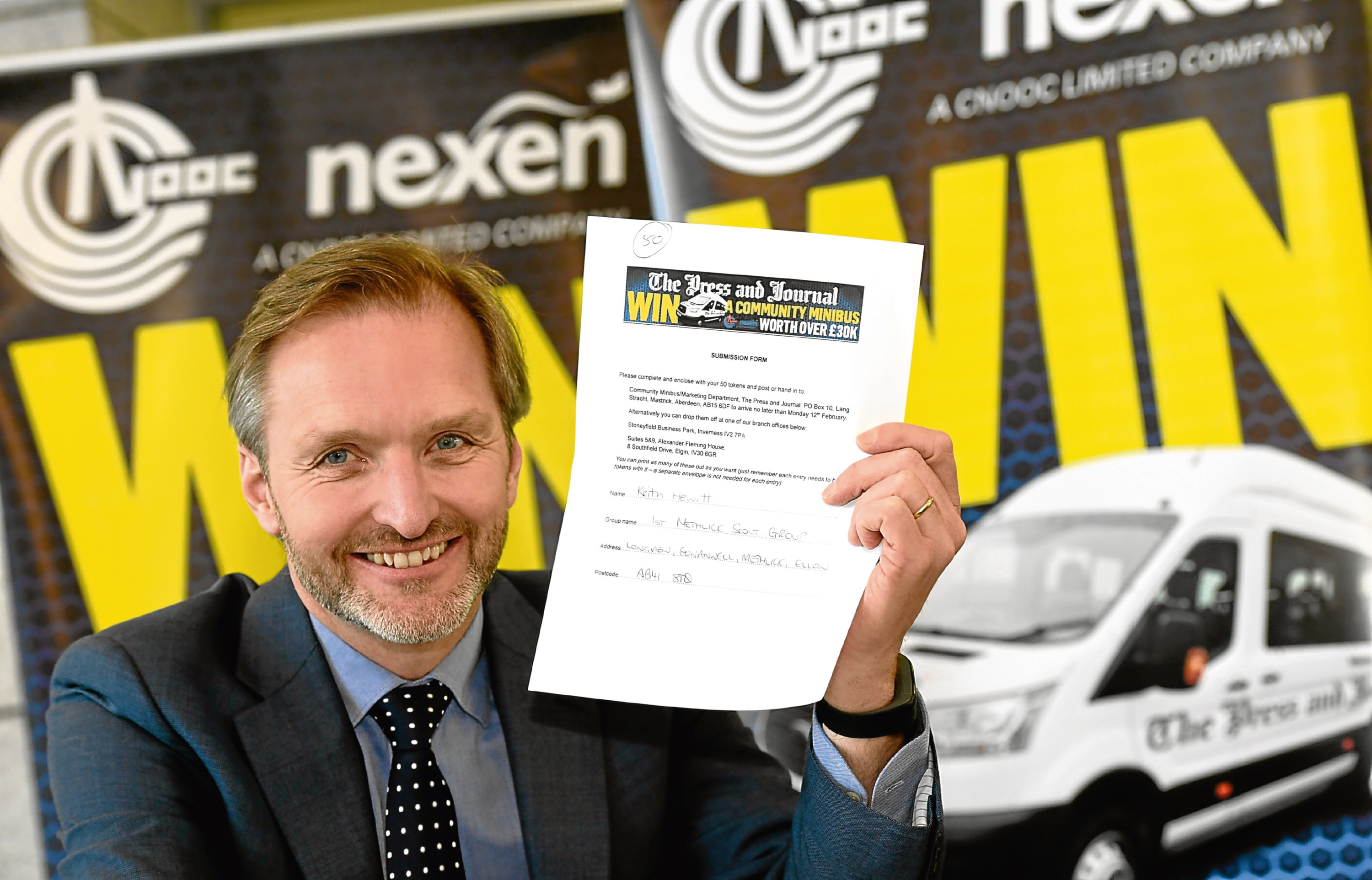 ****NOTE - CONTACT DETAILS FOR THE WINNER ARE ON THE TICKET****
Press and Journal / Nexen, Community Mini Bus Competition.    
Pictured - Chair of Nexen UK CSR committee who made the draw for the winner of the mini bus, holds the winning ticket.      
Picture by Kami Thomson    22-02-18