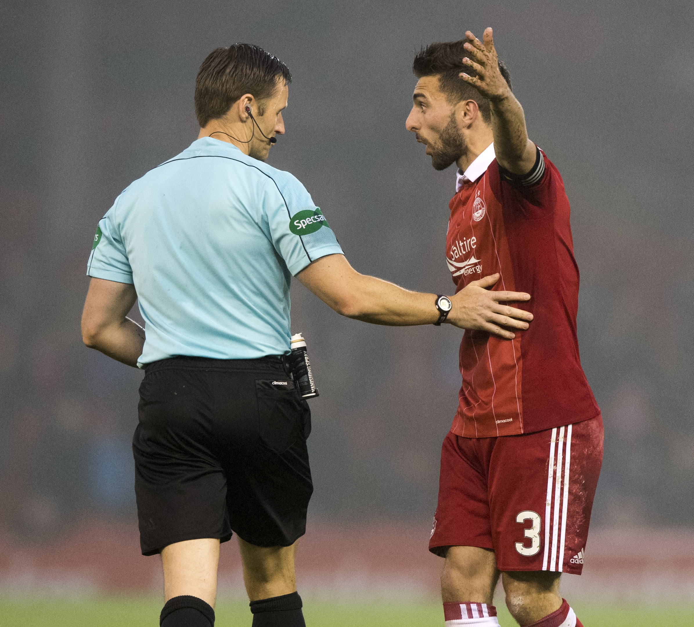 Aberdeen's Graeme Shinnie (right) with referee Steven McLean