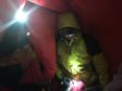 Casualty being assessed inside a bivvy bag. Pic credit: Cairngorm Mountain Rescue Team