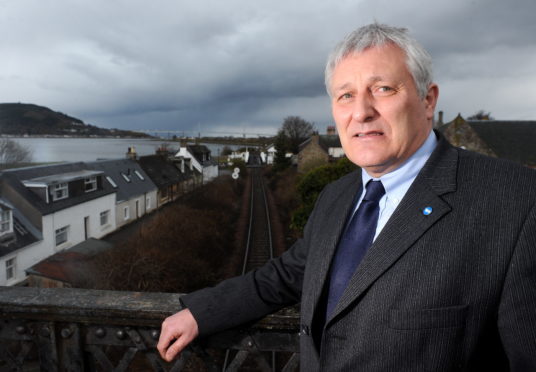 John Finnie at the Clachnaharry railway bridge.
Picture by Sandy McCook.