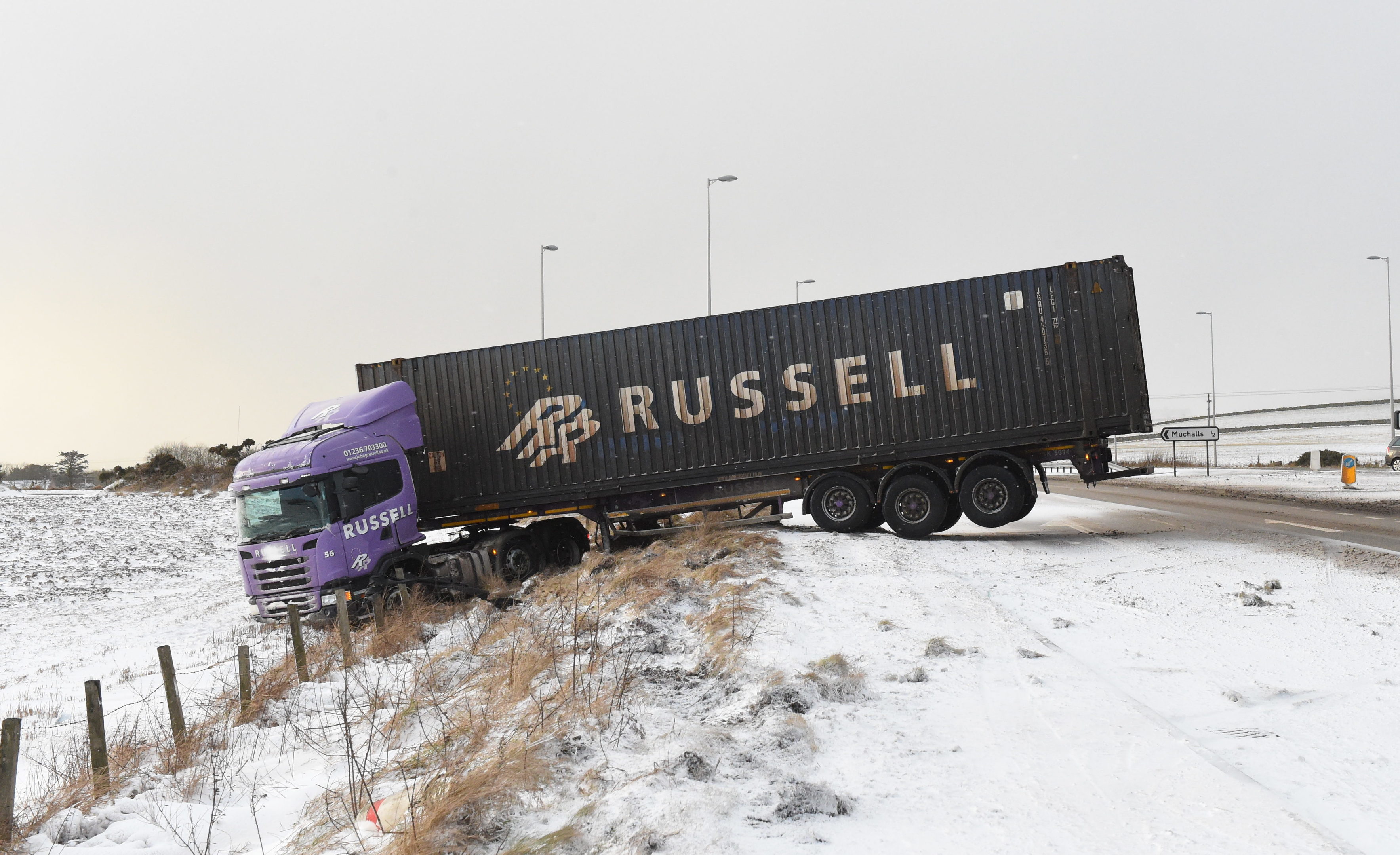 A lorry on the A90 has skidded off road and jackknifed due to the weather conditions.