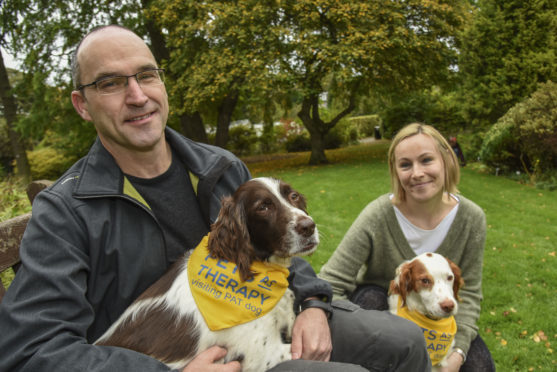 The big-hearted spaniels are no strangers to university life, and have been travelling to the campus with their owners, John and Emily Baird, for years.