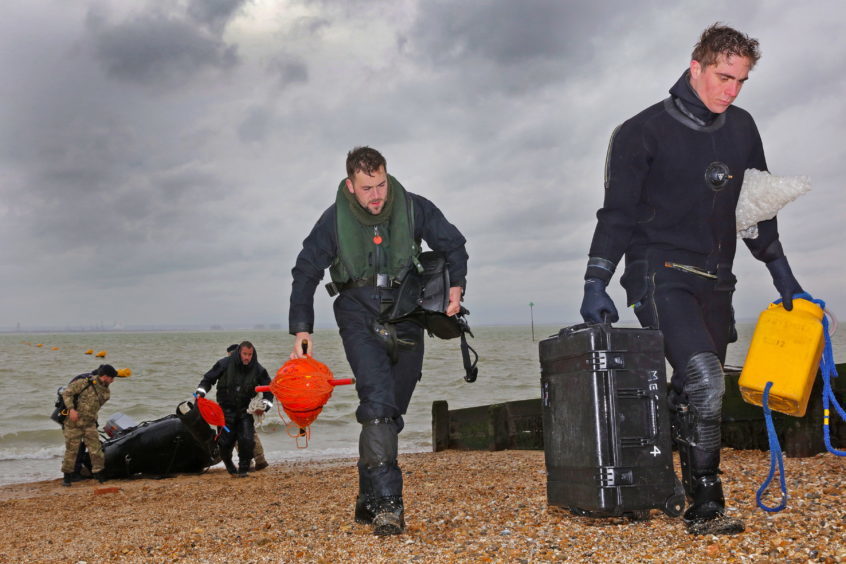 R-L Able Seaman Diver Alessandro Bonato and Leading Diver Tom Parker return after sucessfully destroying the UXO