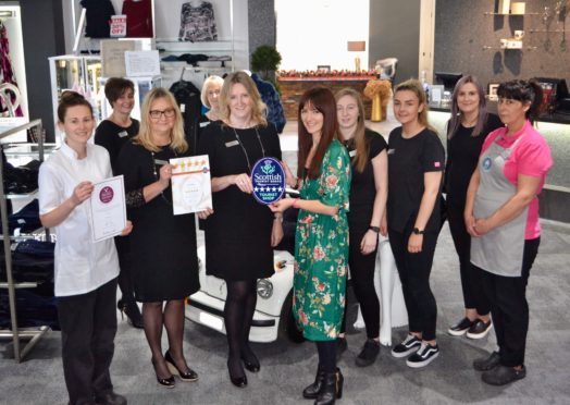 Jo Robinson, VisitScotland Regional Director is pictured presenting a 5 Star plaque and Taste Our Best certificate to owners of The Platform and Annie’s Cakery, Elaine Williams and Annie Anderson, who are joined by their staff.