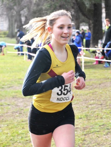 Emily Andrew crossing the finish line in the under 15 and 17 mixed
