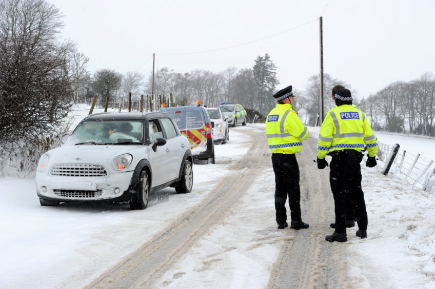 Police Scotland at the scene of a Road Traffic Collision (RTC) on Westhill Drive to the B979 junction, following a few cars has gone off the road and one flipped onto its roof.

Picture by KENNY ELRICK     14/02/2018