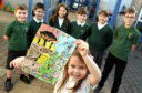 Their creations will be brought to life for display at the Gardening Scotland exhibition in Edinburgh this June.    
Pictured - Mill O Forest pupil Jenna Warden holding their design with fellow pupils L-R Elijah Kriston, Shaun Cadger, Keira Kirk, Harry Middleton, Rhea Walker, Murray Jamieson.   
Picture by Kami Thomson    21-02-18