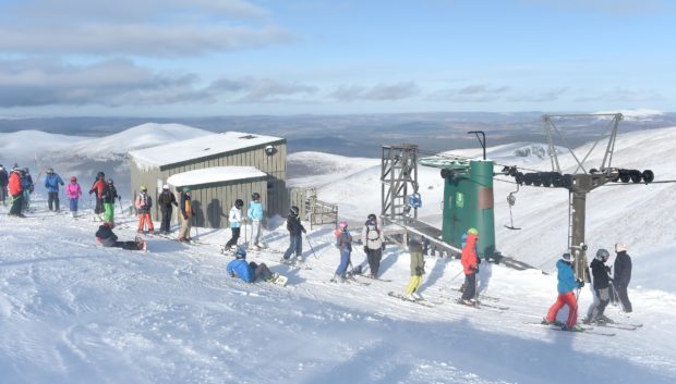 Skiers on the slopes at the Cairngorm Mountain.