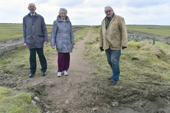 Boddam Community Association members Billy and Betty May, and Sam Coull are braced to lose one of their walking paths.
